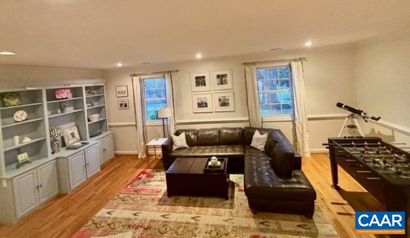 2603 Holkham Drive Charlottesville, VA 22901 - Photo 30 of 60 a living room with furniture and a wooden floor