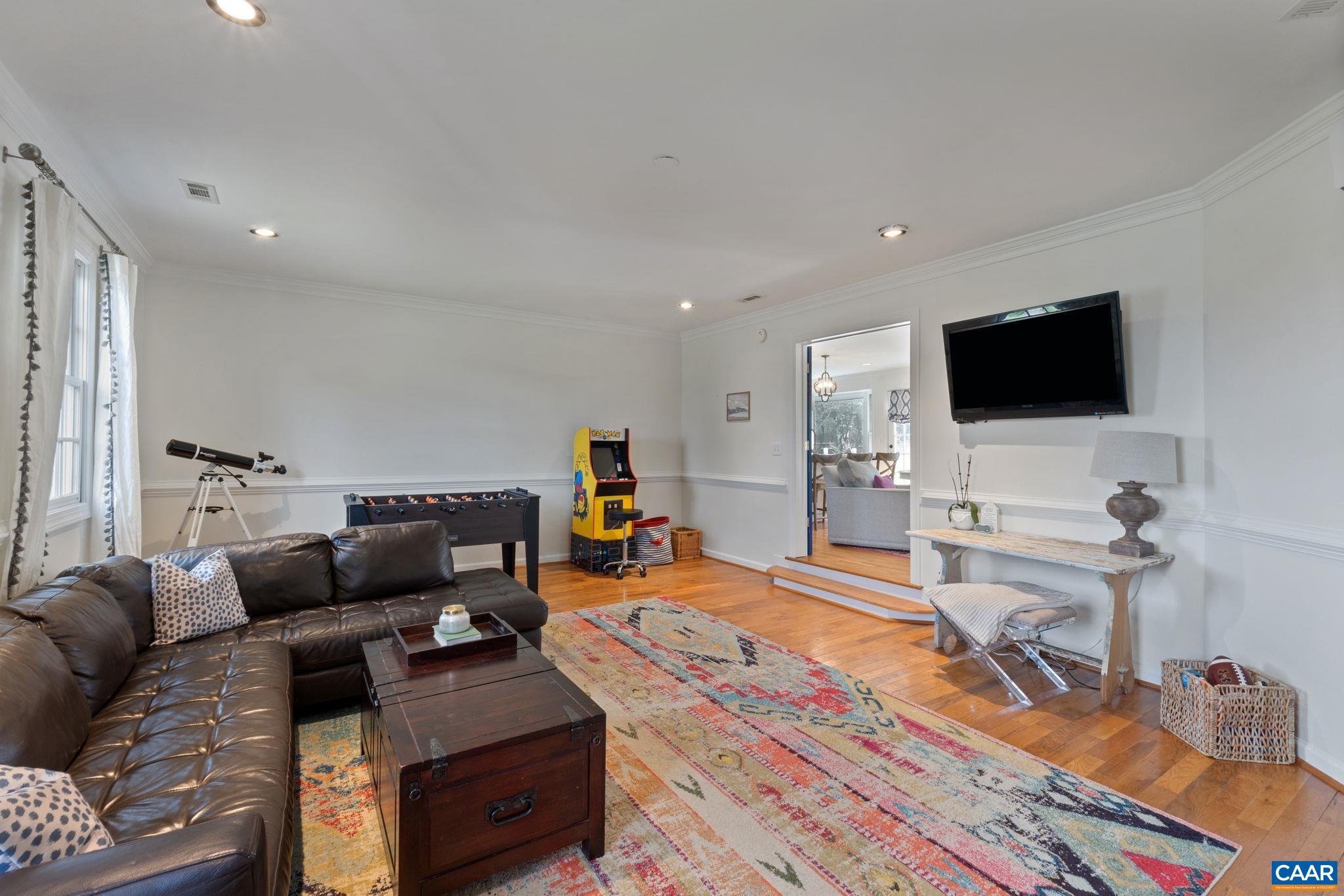 2603 Holkham Drive Charlottesville, VA 22901 - Photo 31 of 60 a living room with furniture and a flat screen tv