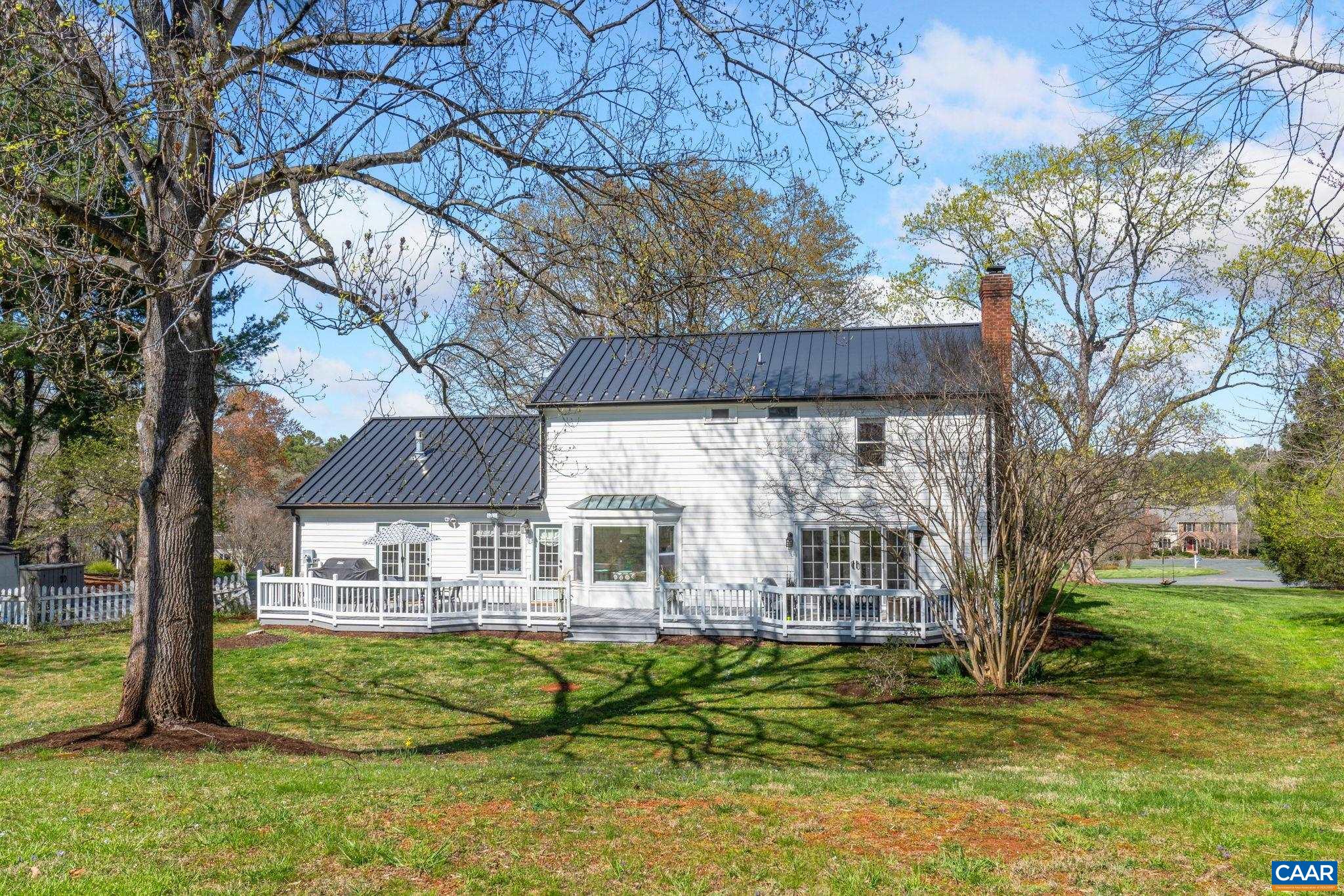 2603 Holkham Drive Charlottesville, VA 22901 - Photo 42 of 60 a view of house with outdoor seating and covered with trees