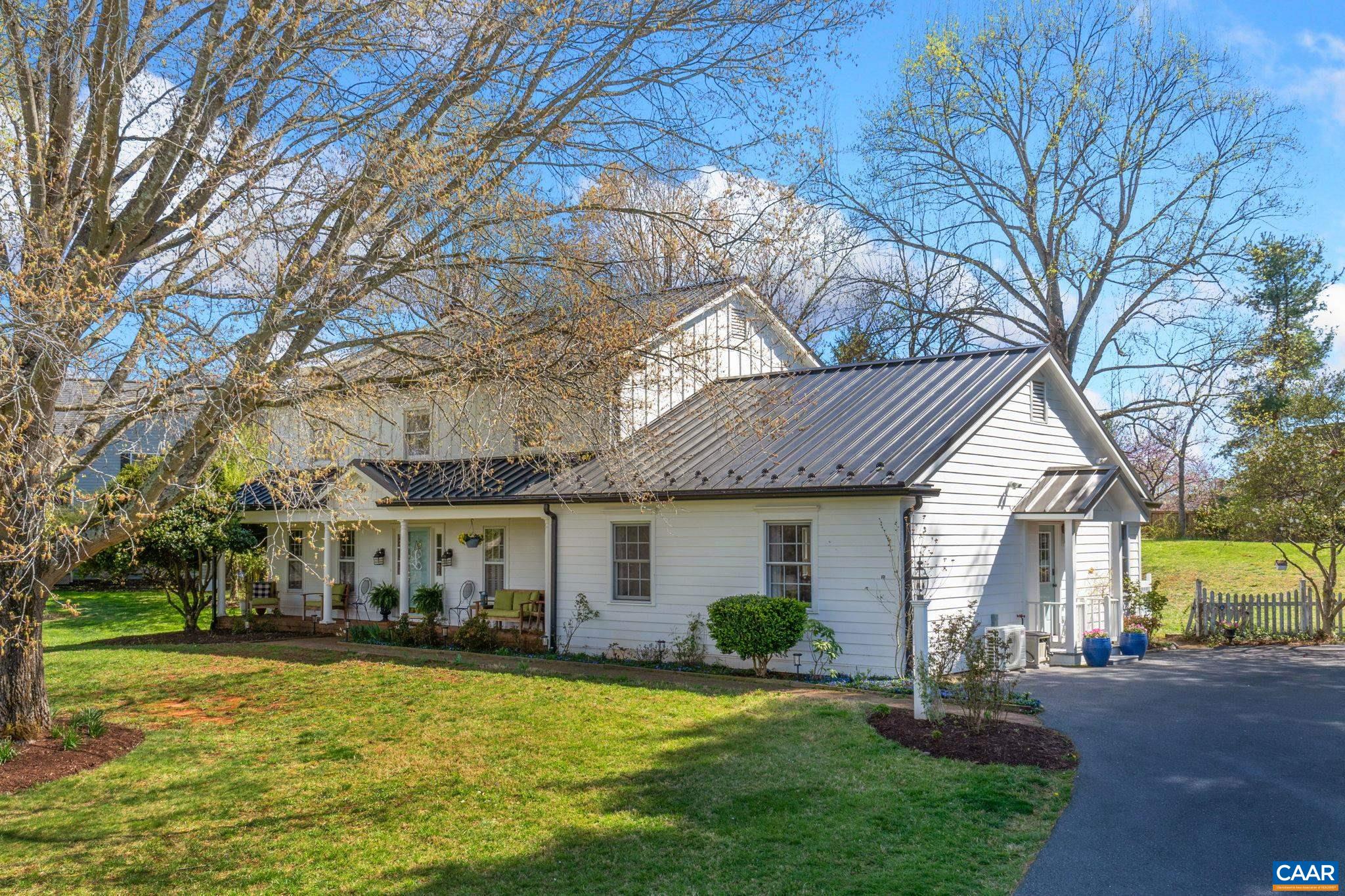 2603 Holkham Drive Charlottesville, VA 22901 - Photo 56 of 60 a front view of a house with a garden and trees