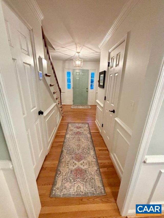 2603 Holkham Drive Charlottesville, VA 22901 - Photo 8 of 60 a view of a hallway with wooden floor and staircase