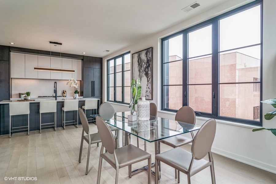 1400 West Monroe Street, Unit 6E Chicago, IL 60607 - Photo 5 of 12 a view of a dining room with furniture window and outside view