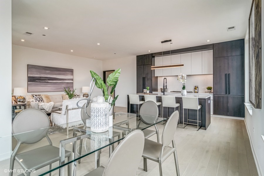 1400 West Monroe Street, Unit 6E Chicago, IL 60607 - Photo 6 of 12 a view of a dining room with furniture window and wooden floor