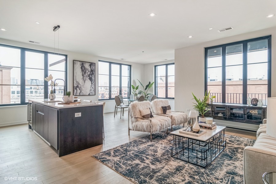 1400 West Monroe Street, Unit 6E Chicago, IL 60607 - Photo 8 of 12 a living room with furniture and a large window