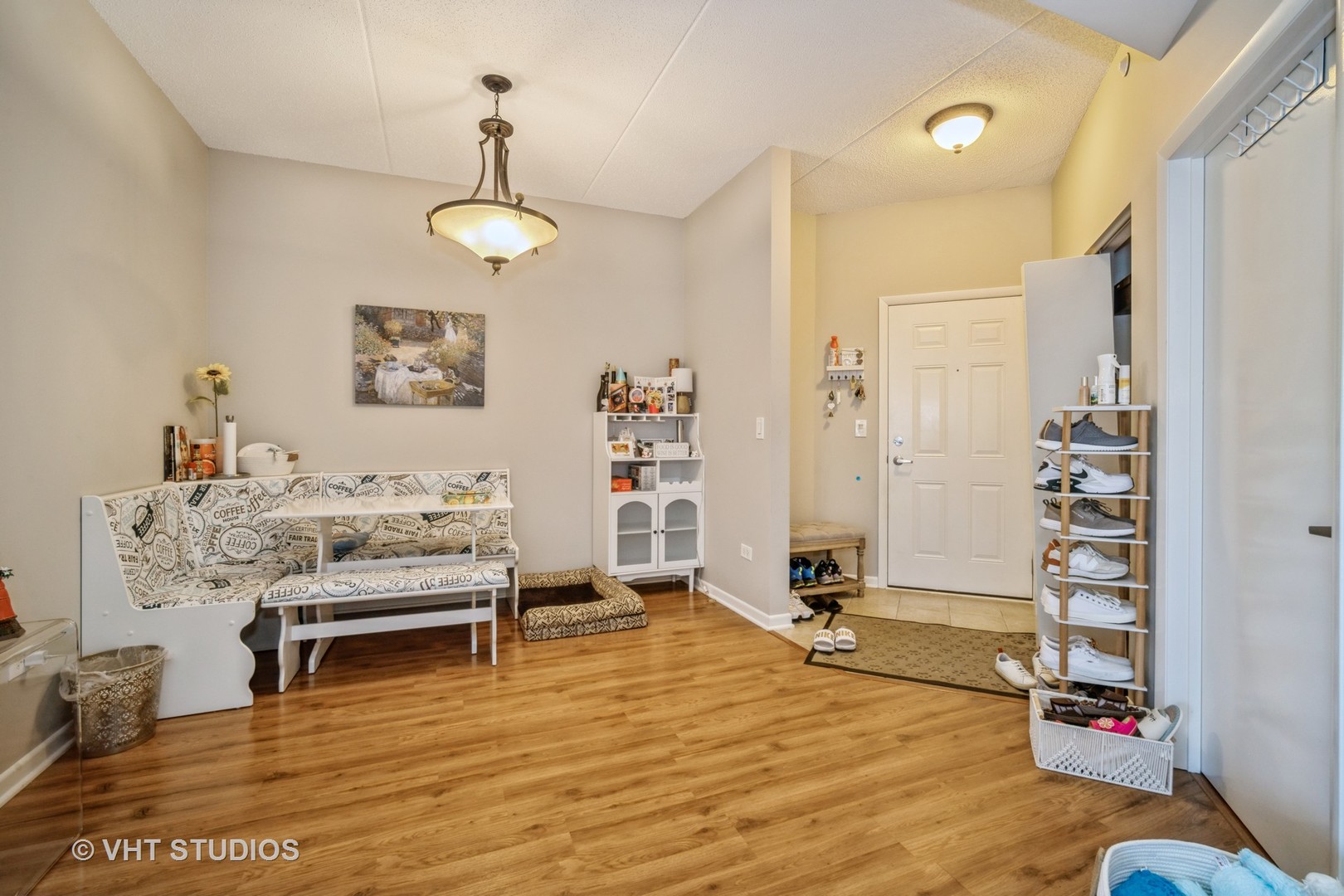 720 Prestwick Lane, Unit 307 Wheeling, IL 60090 - Photo 2 of 10 a view of a room with furniture and wooden floor