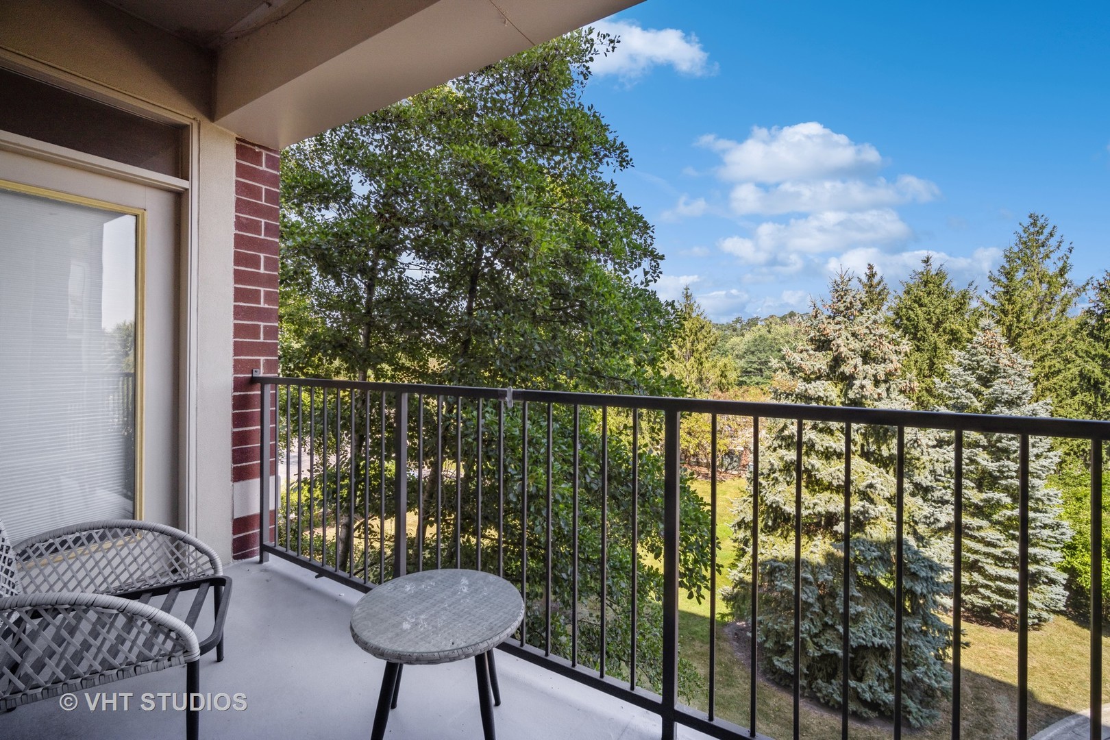 720 Prestwick Lane, Unit 307 Wheeling, IL 60090 - Photo 10 of 10 a view of a balcony with chairs