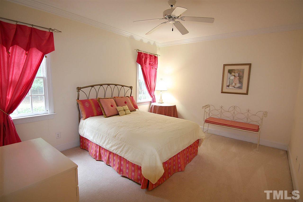 10900 Fitzwilliam Street Raleigh, NC 27614 - Photo 12 of 25 a bed room with a bed and a couch