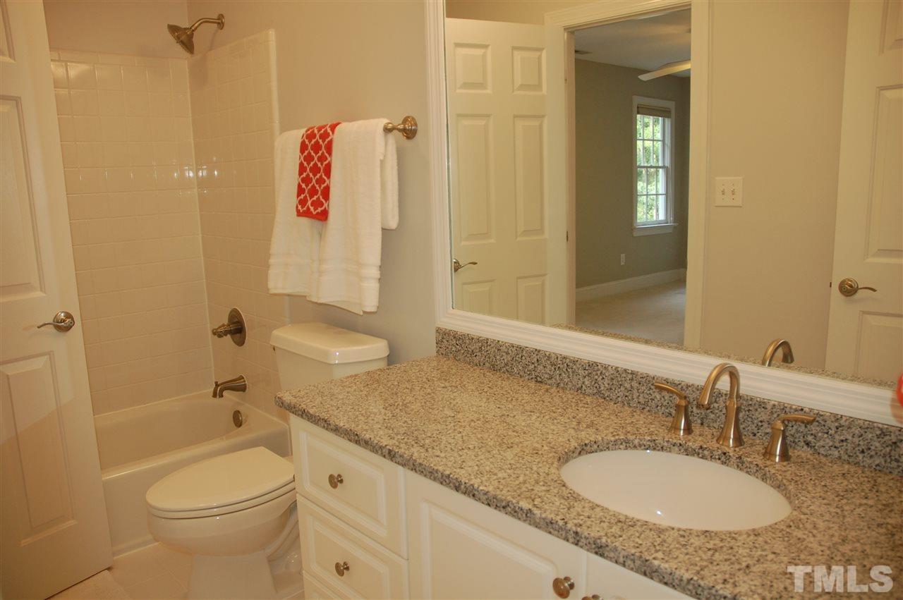 10900 Fitzwilliam Street Raleigh, NC 27614 - Photo 15 of 25 a bathroom with a granite countertop sink toilet and shower
