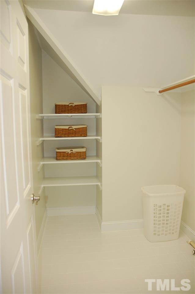 10900 Fitzwilliam Street Raleigh, NC 27614 - Photo 19 of 25 a view of walk in closet with empty racks