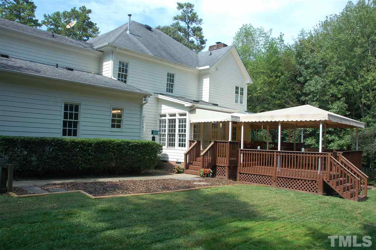 10900 Fitzwilliam Street Raleigh, NC 27614 - Photo 22 of 25 a view of a chair and table in backyard of the house