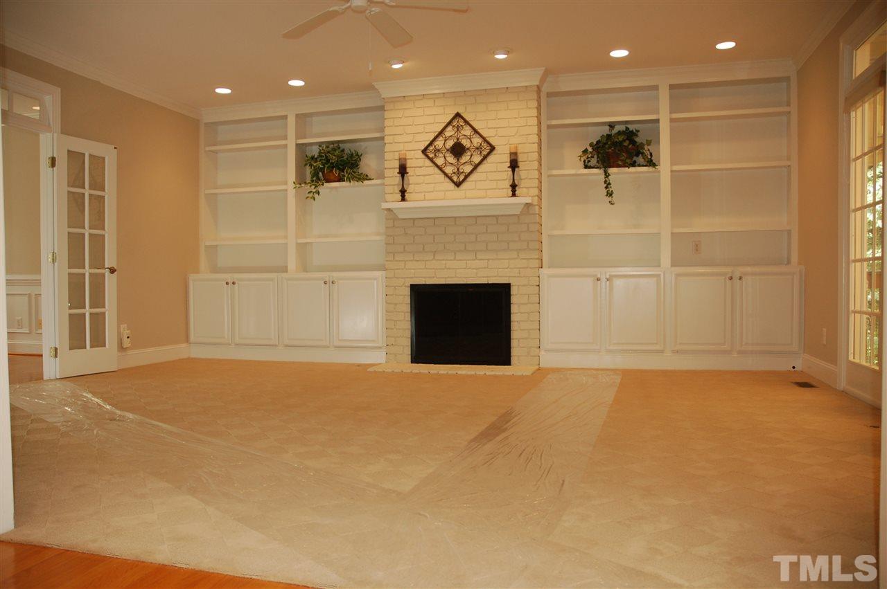 10900 Fitzwilliam Street Raleigh, NC 27614 - Photo 7 of 25 a view of an empty room with a fireplace