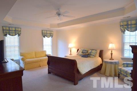 10900 Fitzwilliam Street Raleigh, NC 27614 - Photo 9 of 25 a bedroom with a bed couch and window