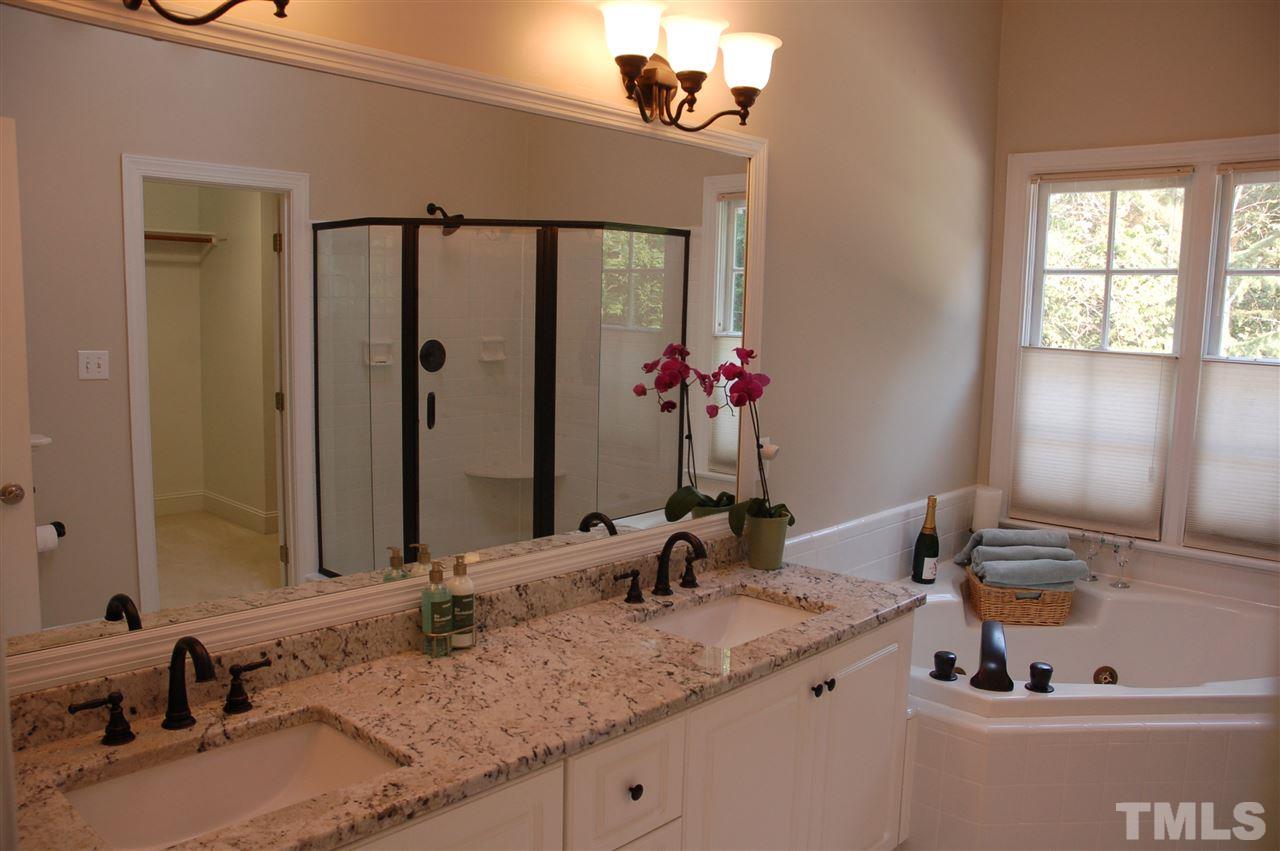 10900 Fitzwilliam Street Raleigh, NC 27614 - Photo 10 of 25 a bathroom with a granite countertop sink and a mirror