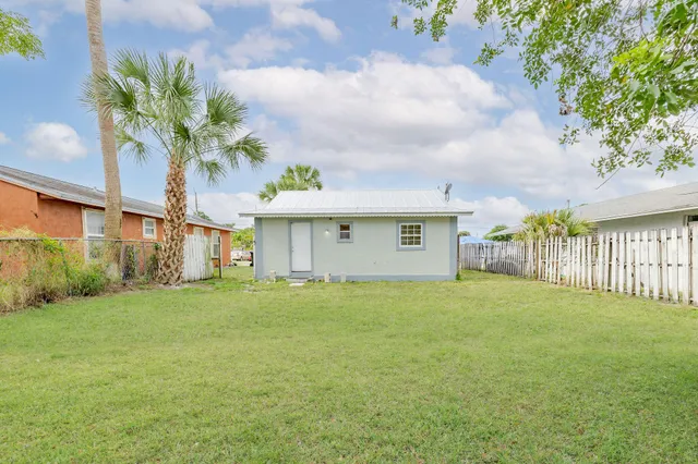 a front view of house with yard and seating