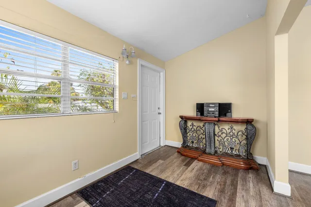a view of entryway with wooden floor