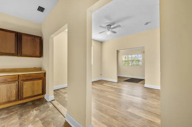 a view of a kitchen with electric appliances