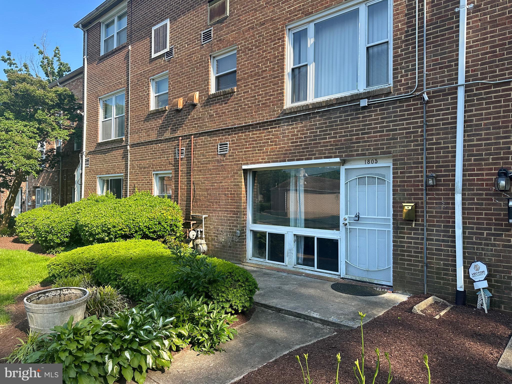 1805 Addison Road South District Heights, MD 20747 - Photo 1 of 28 a front view of a house with a yard