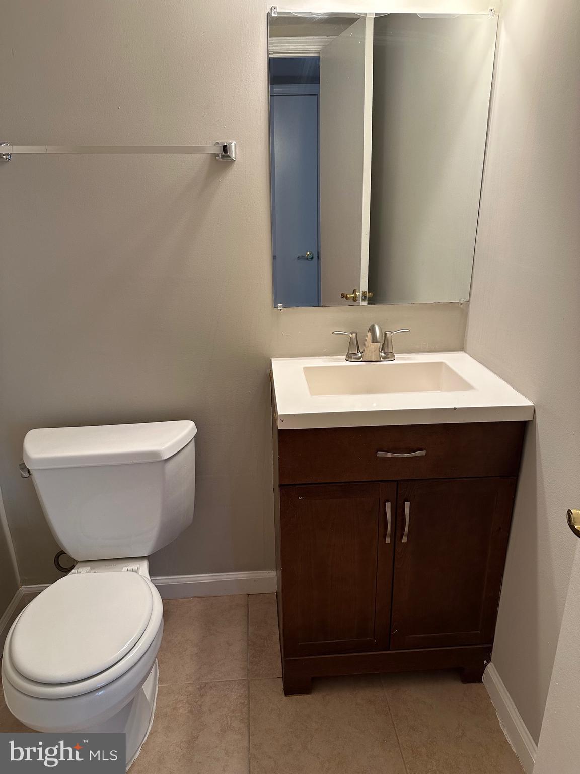 1805 Addison Road South District Heights, MD 20747 - Photo 11 of 28 a bathroom with a toilet sink and mirror
