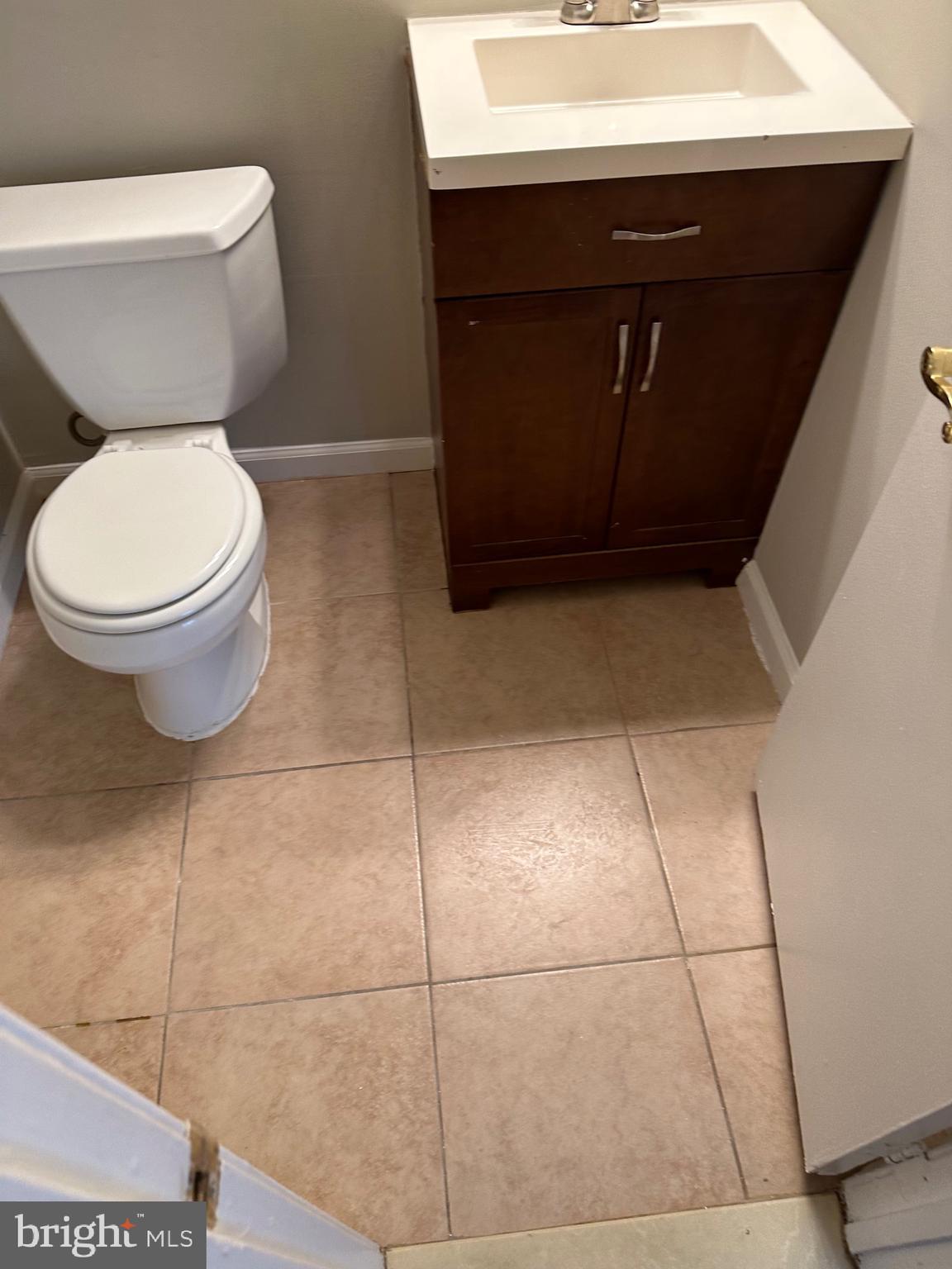 1805 Addison Road South District Heights, MD 20747 - Photo 12 of 28 a bathroom with a sink and a toilet