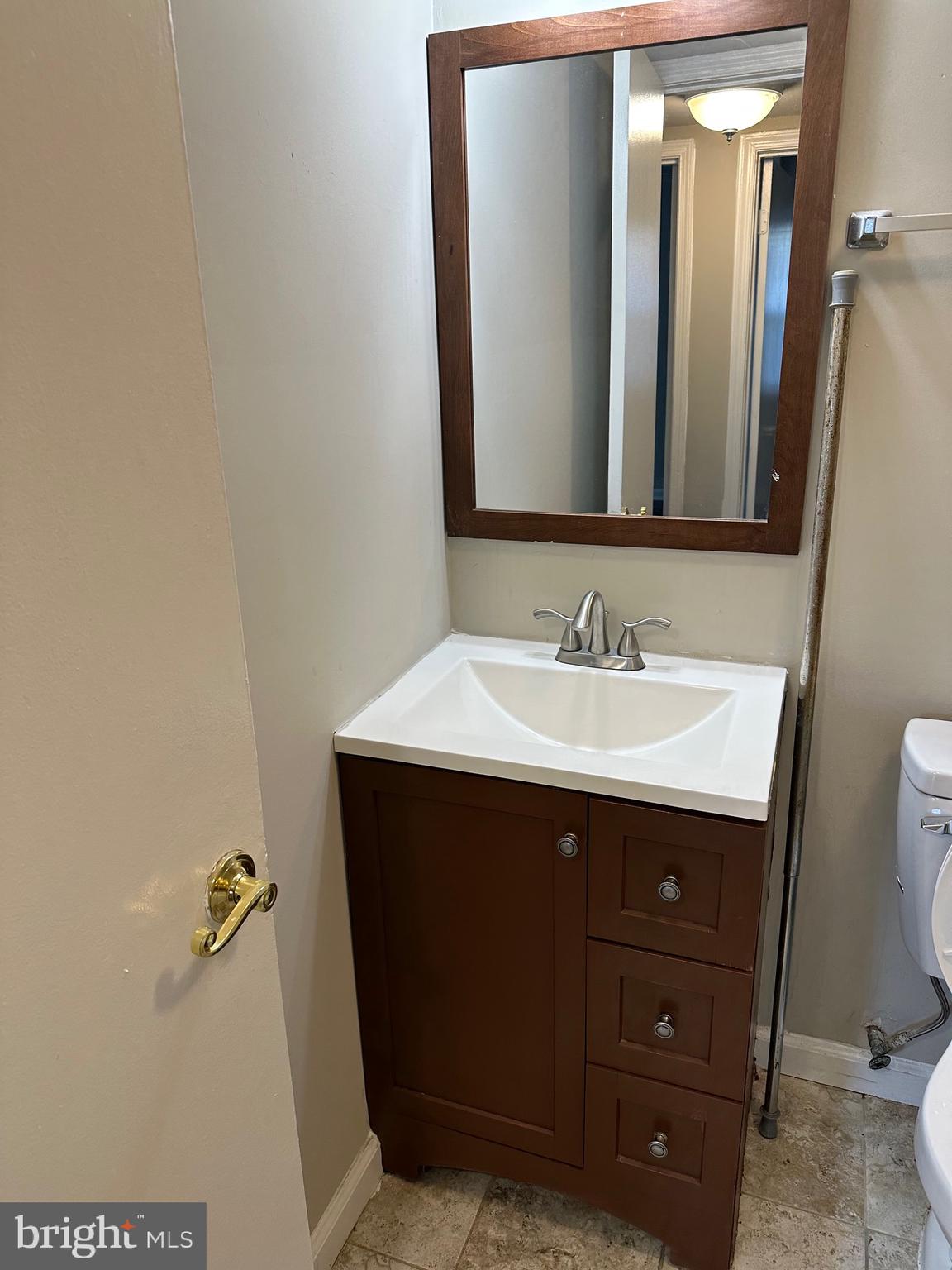 1805 Addison Road South District Heights, MD 20747 - Photo 14 of 28 a bathroom with a sink vanity and a mirror