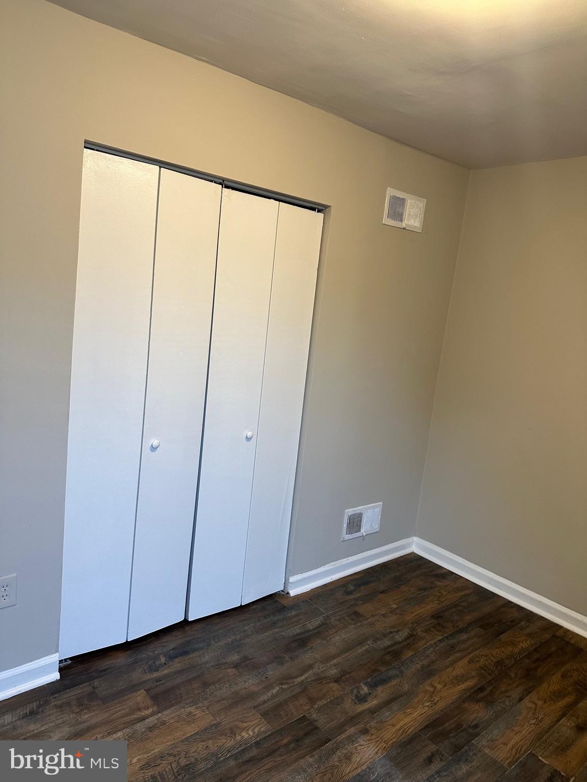 1805 Addison Road South District Heights, MD 20747 - Photo 16 of 28 a view of an empty room with wooden floor