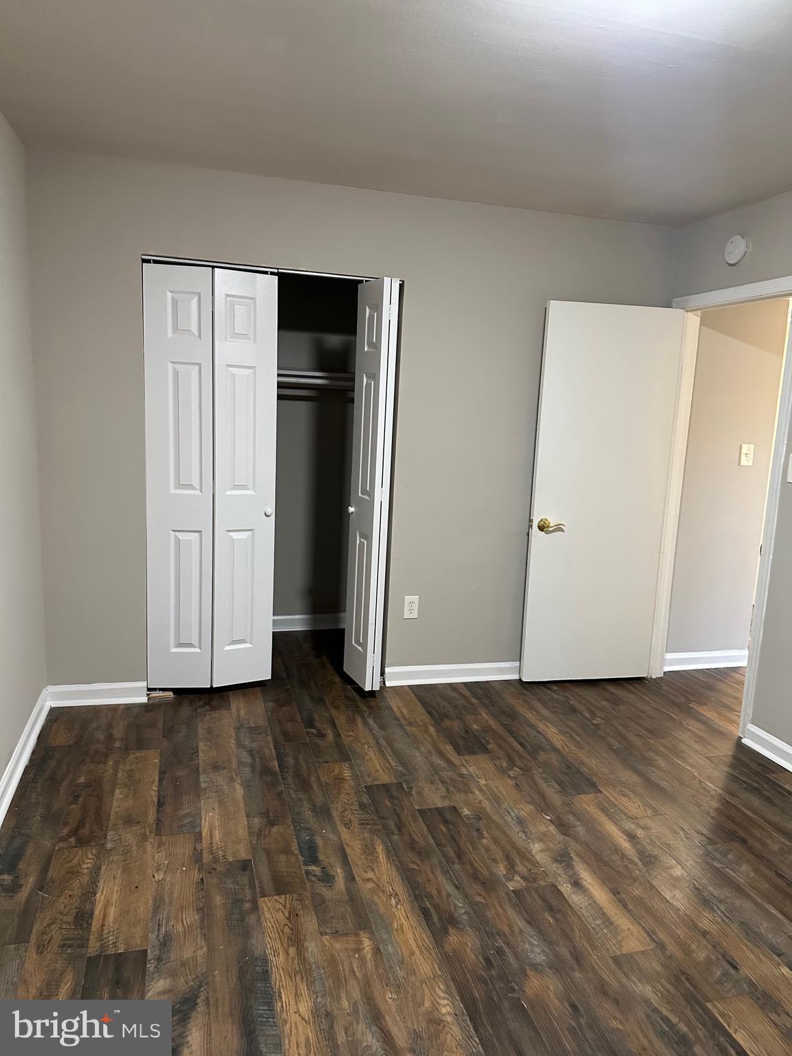 1805 Addison Road South District Heights, MD 20747 - Photo 28 of 28 a view of an empty room with closet and wooden floor