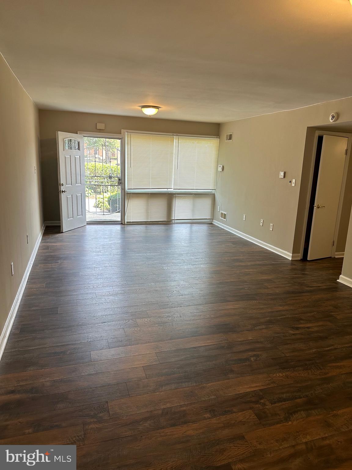 1805 Addison Road South District Heights, MD 20747 - Photo 5 of 28 a view of empty room with wooden floor and fan