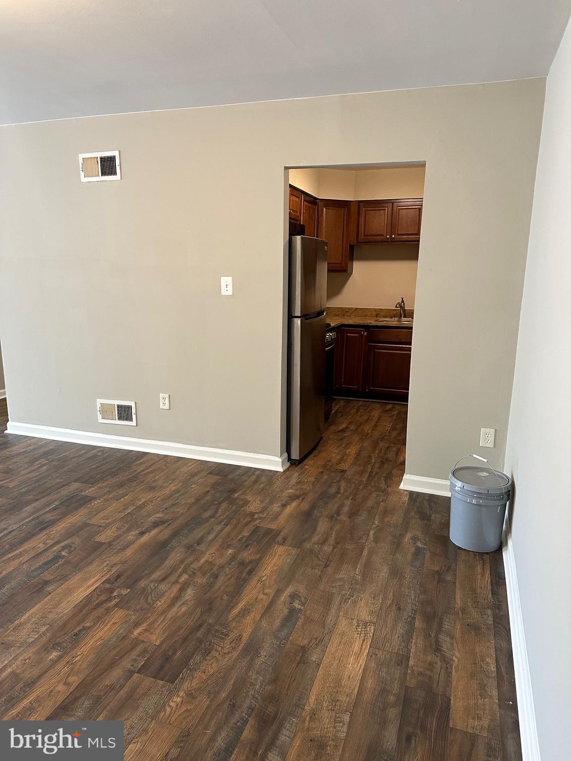 1805 Addison Road South District Heights, MD 20747 - Photo 6 of 28 a view of a room with wooden floor and chair