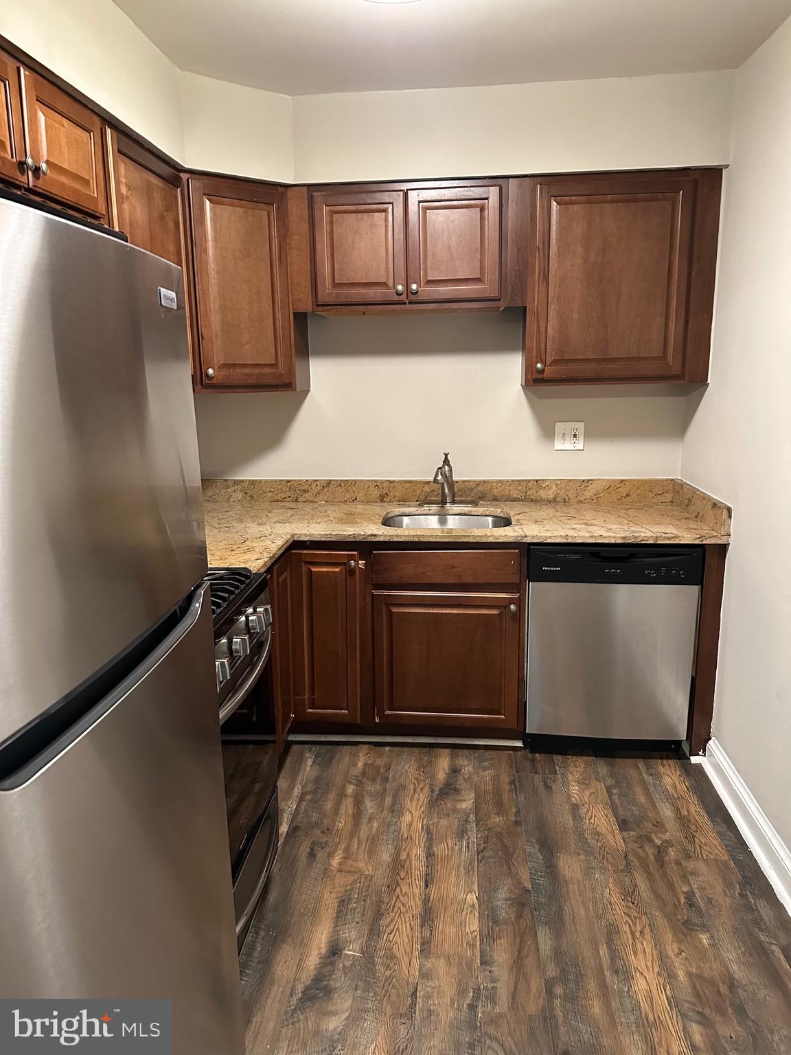 1805 Addison Road South District Heights, MD 20747 - Photo 7 of 28 a kitchen with stainless steel appliances granite countertop a stove a sink and a refrigerator