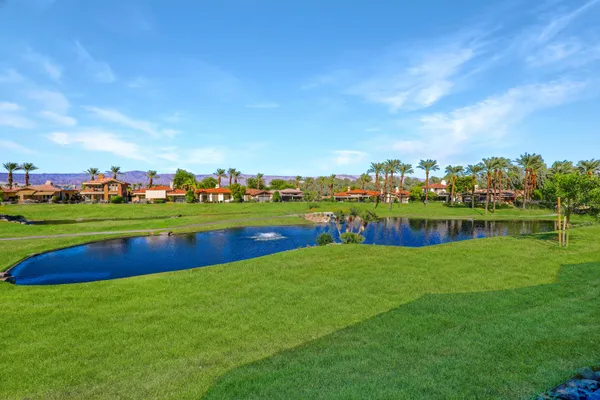 a view of a golf course with a lake