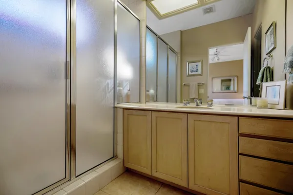 a bathroom with a double vanity sink and a mirror