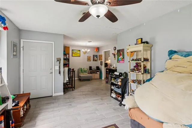a view of a livingroom with workspace and a window