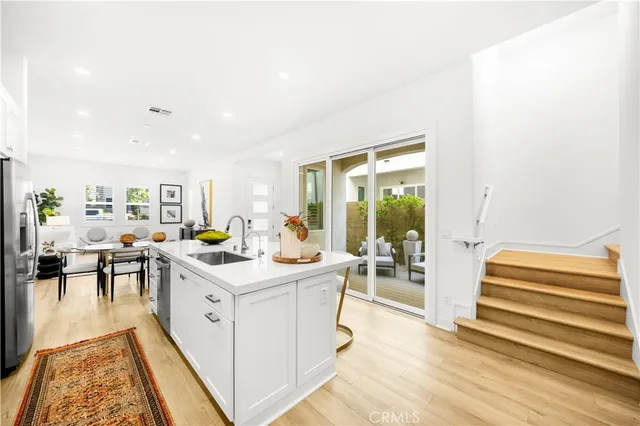 a room with a sink and a table in it