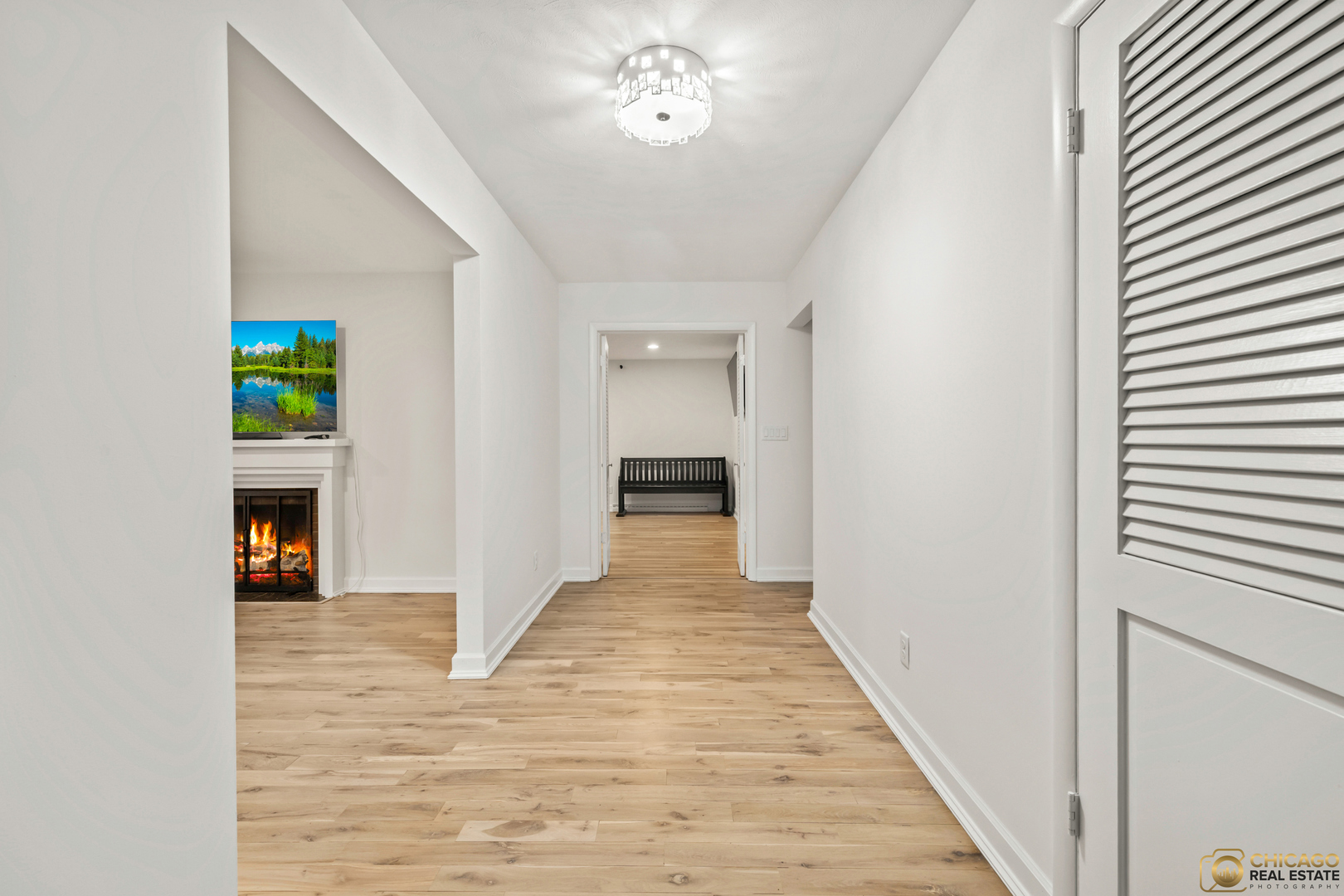 8019 South Malta Road DeKalb, IL 60115 - Photo 11 of 51 a view of a hallway with wooden floor and a livingroom