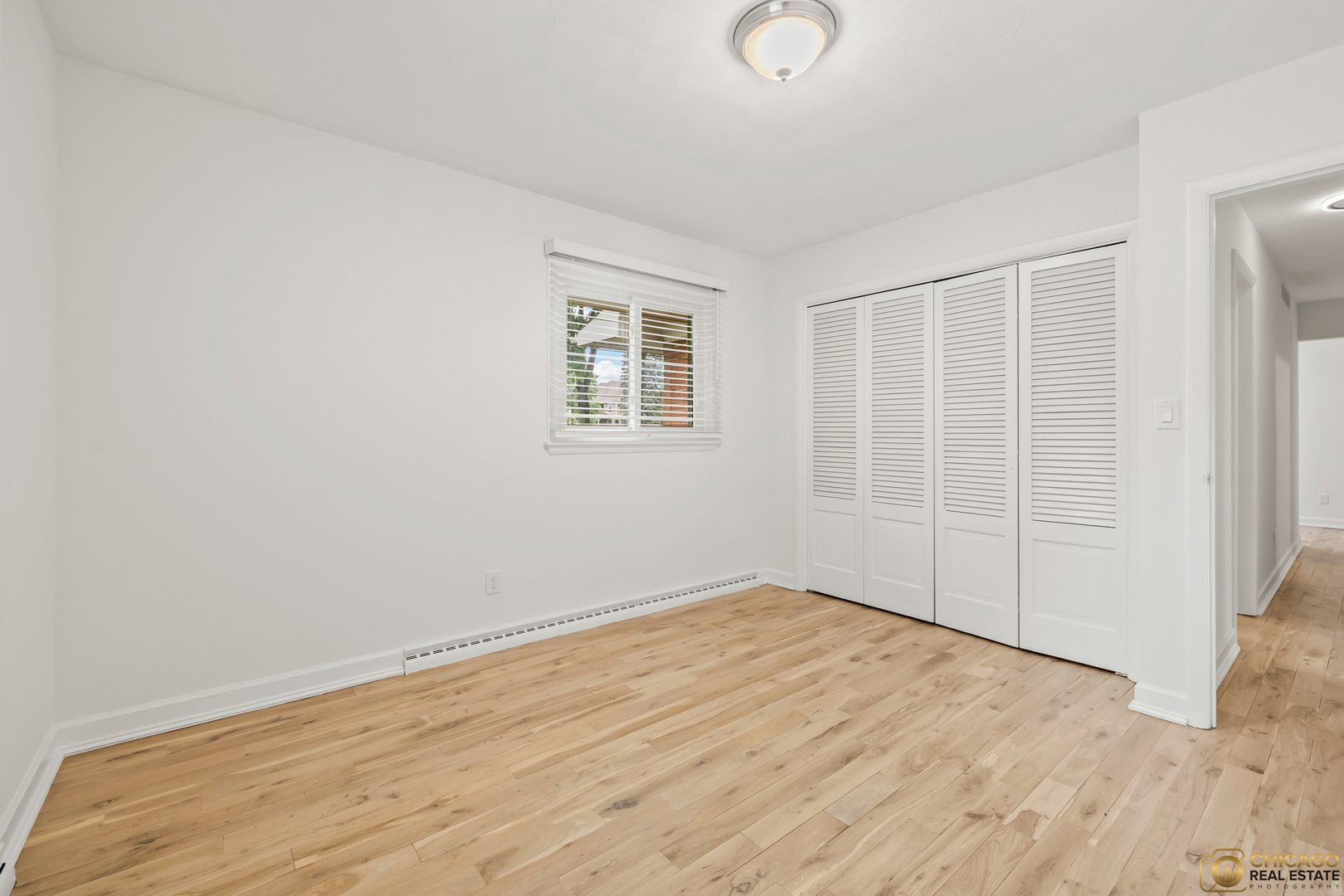 8019 South Malta Road DeKalb, IL 60115 - Photo 26 of 51 an empty room with wooden floor and windows