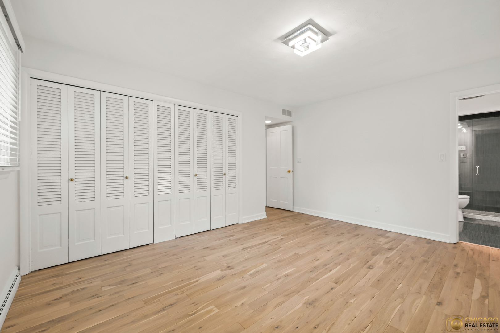 8019 South Malta Road DeKalb, IL 60115 - Photo 29 of 51 a view of an empty room with wooden floor