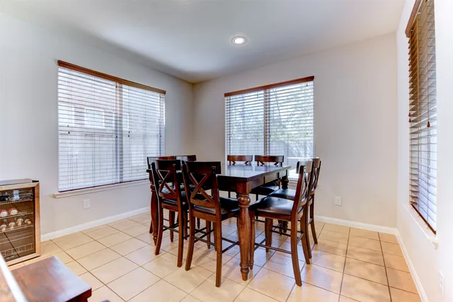 a view of a dining room with furniture and window