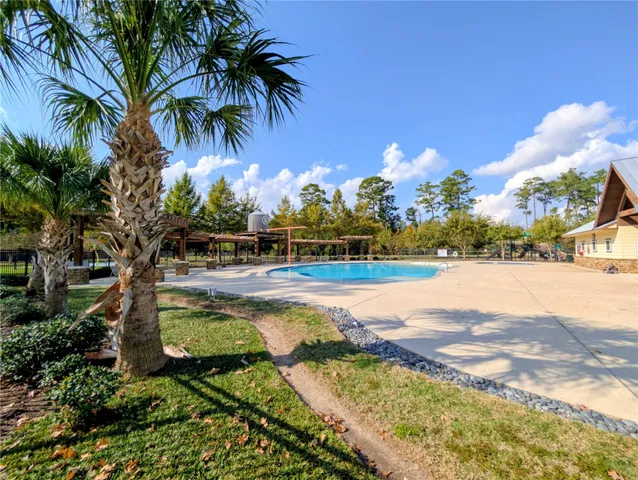 a view of a yard with swimming pool