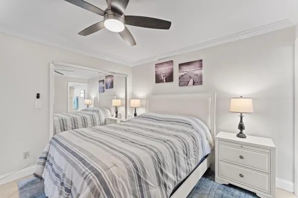 a bedroom with a bed and a lamp