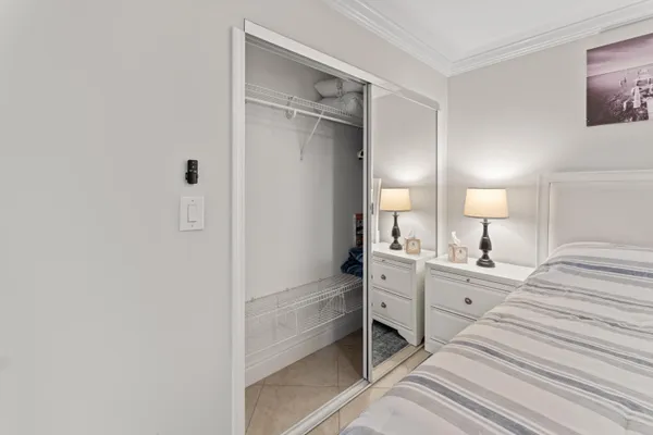 a room with a bed and a cabinets