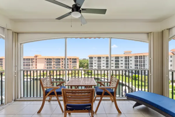 a view of a balcony with furniture