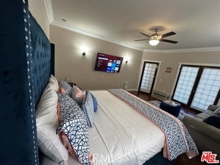 1025 Locust Avenue Long Beach, CA 90813 - Photo 11 of 64 a bedroom with a large bed and a chandelier