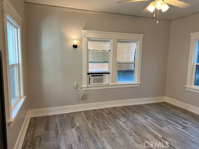1025 Locust Avenue Long Beach, CA 90813 - Photo 17 of 64 a view of an empty room with wooden floor and a window