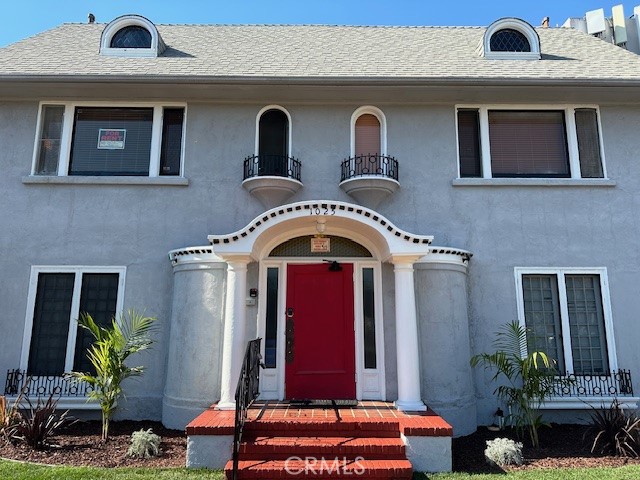 1025 Locust Avenue Long Beach, CA 90813 - Photo 2 of 64 a front view of a house with garden