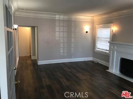 1025 Locust Avenue Long Beach, CA 90813 - Photo 25 of 64 a view of empty room with wooden floor and fireplace