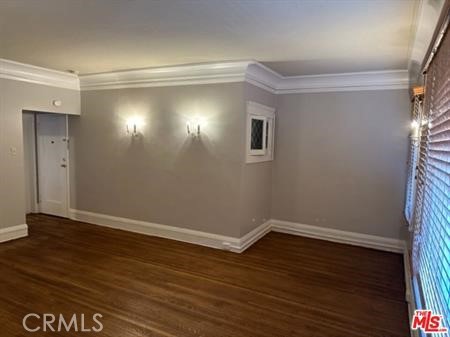 1025 Locust Avenue Long Beach, CA 90813 - Photo 27 of 64 a view of an empty room with wooden floor and a window
