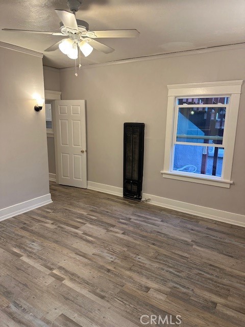 1025 Locust Avenue Long Beach, CA 90813 - Photo 37 of 64 a view of an empty room with wooden floor closet and a ceiling fan