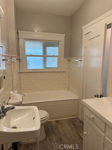 1025 Locust Avenue Long Beach, CA 90813 - Photo 41 of 64 a bathroom with a sink a toilet and shower