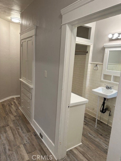 1025 Locust Avenue Long Beach, CA 90813 - Photo 42 of 64 a bathroom with a sink a toilet and shower