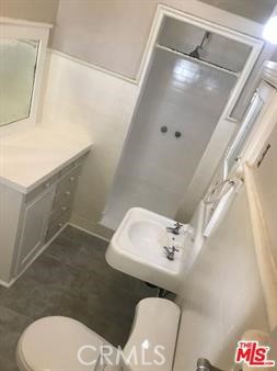 1025 Locust Avenue Long Beach, CA 90813 - Photo 44 of 64 a bathroom with a sink and a mirror